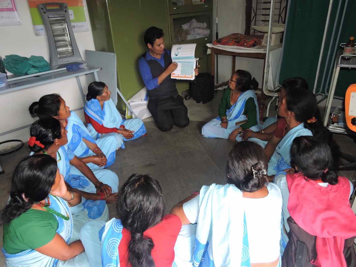 Women community health volunteers attending a health education session