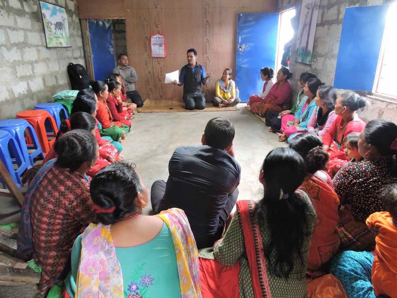 A facilitator meeting with a women's network group for documentary production