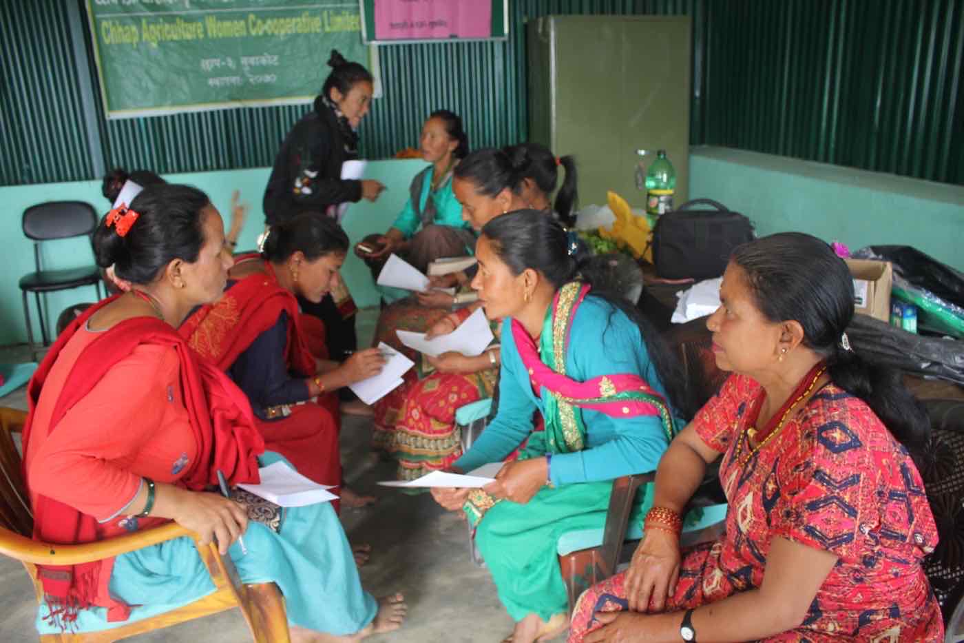 Women speaking in pairs during an interactive Chhap Women's Cooperative interview