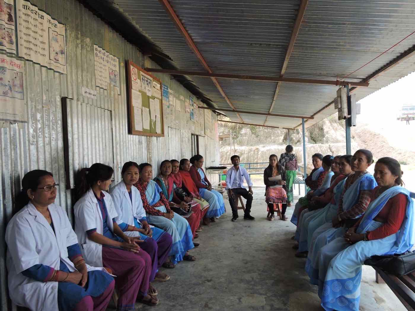 Health post staff and female community health volunteers meeting in Talakhu