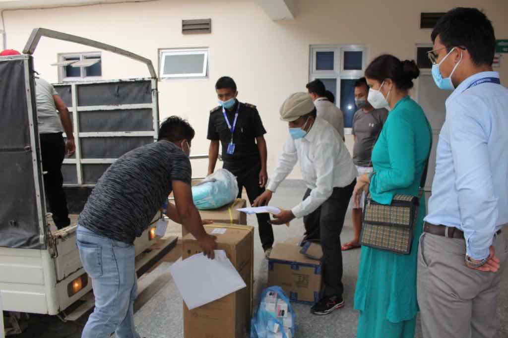 Health equipment being handed over at a hospital during the COVID-19 response