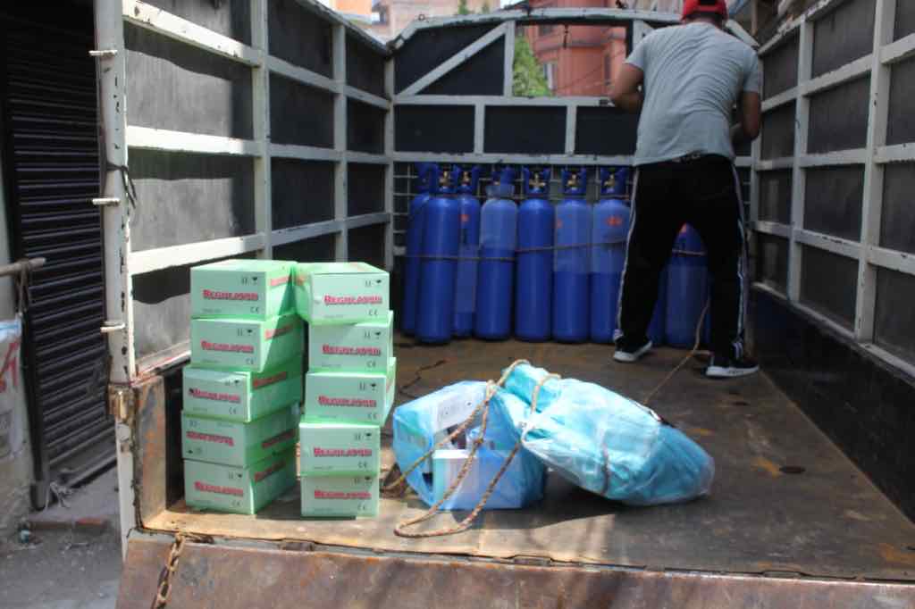 Oxygen cylinders and medical equipment loaded in a truck for COVID-19 response