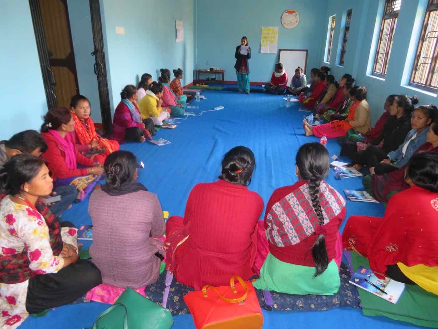 Women seated in a circle during a gender-based violence workshop in Bhimphedi