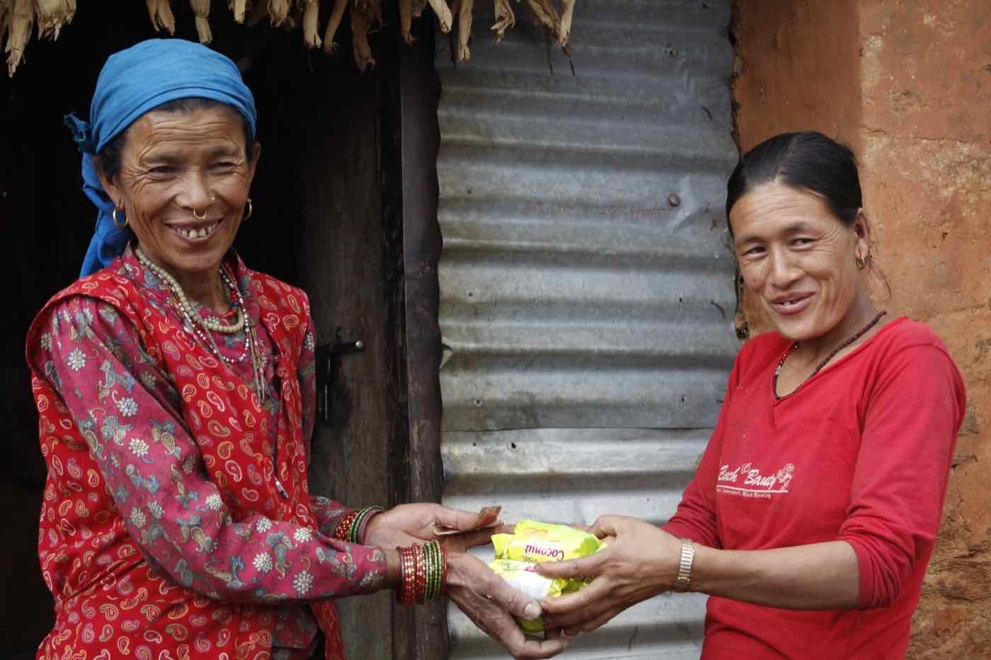 A Marsani Tamang, member of the Dhandakharka women's group in Samundratar, receiving hygiene support