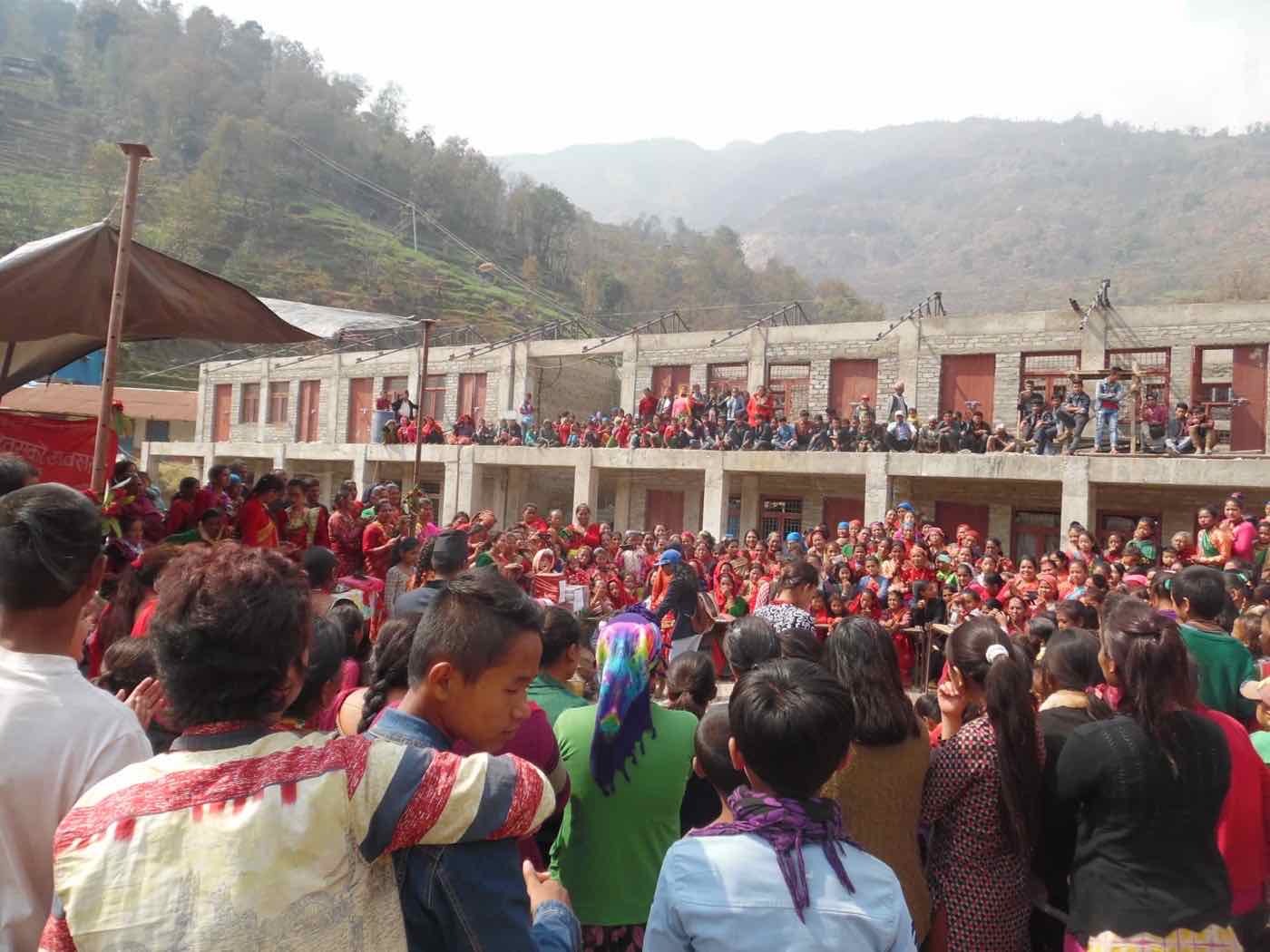A large crowd of women and girls celebrating Women's Day in Nuwakot during the Harmony Project