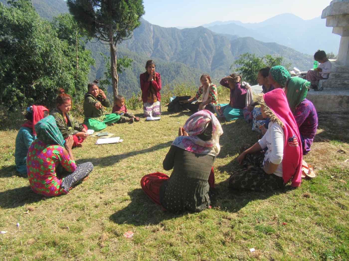 A Women Action Group meeting on a hillside in Baikuntha