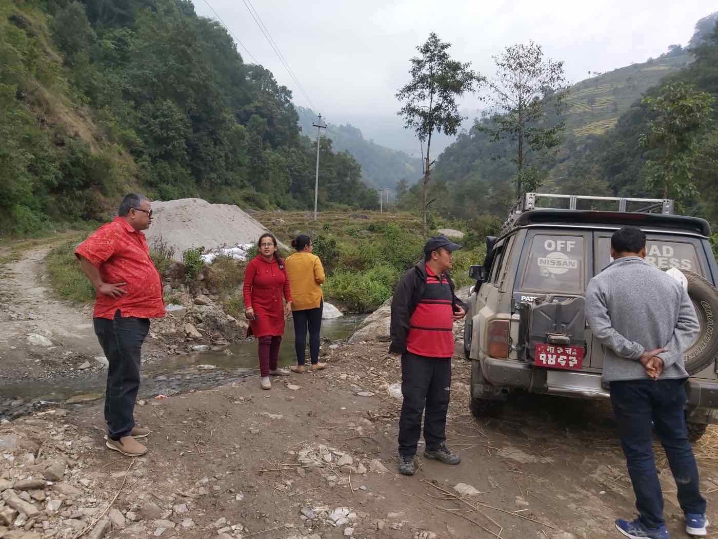 The Joy Project field team beside a mountain stream on the road to Betini