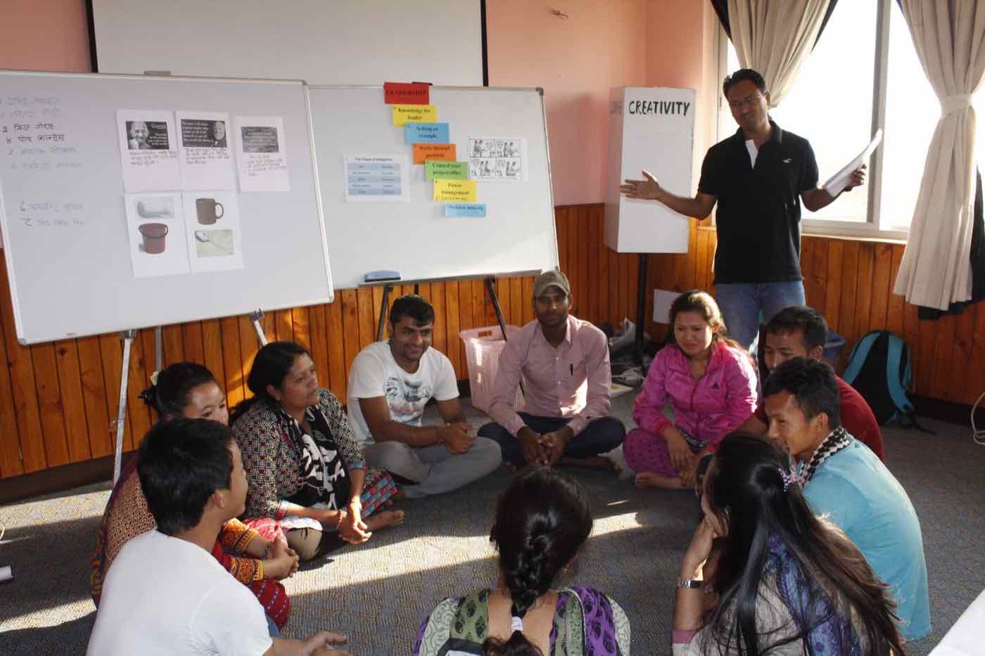 Community Development Management diploma participants seated in a facilitated discussion circle