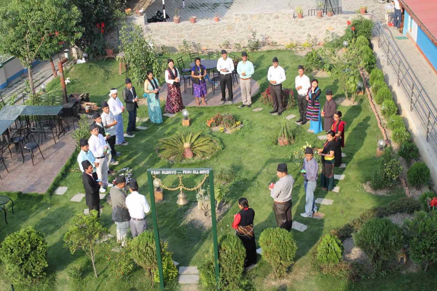 Community Development Management diploma participants gathered outdoors in a reflection circle
