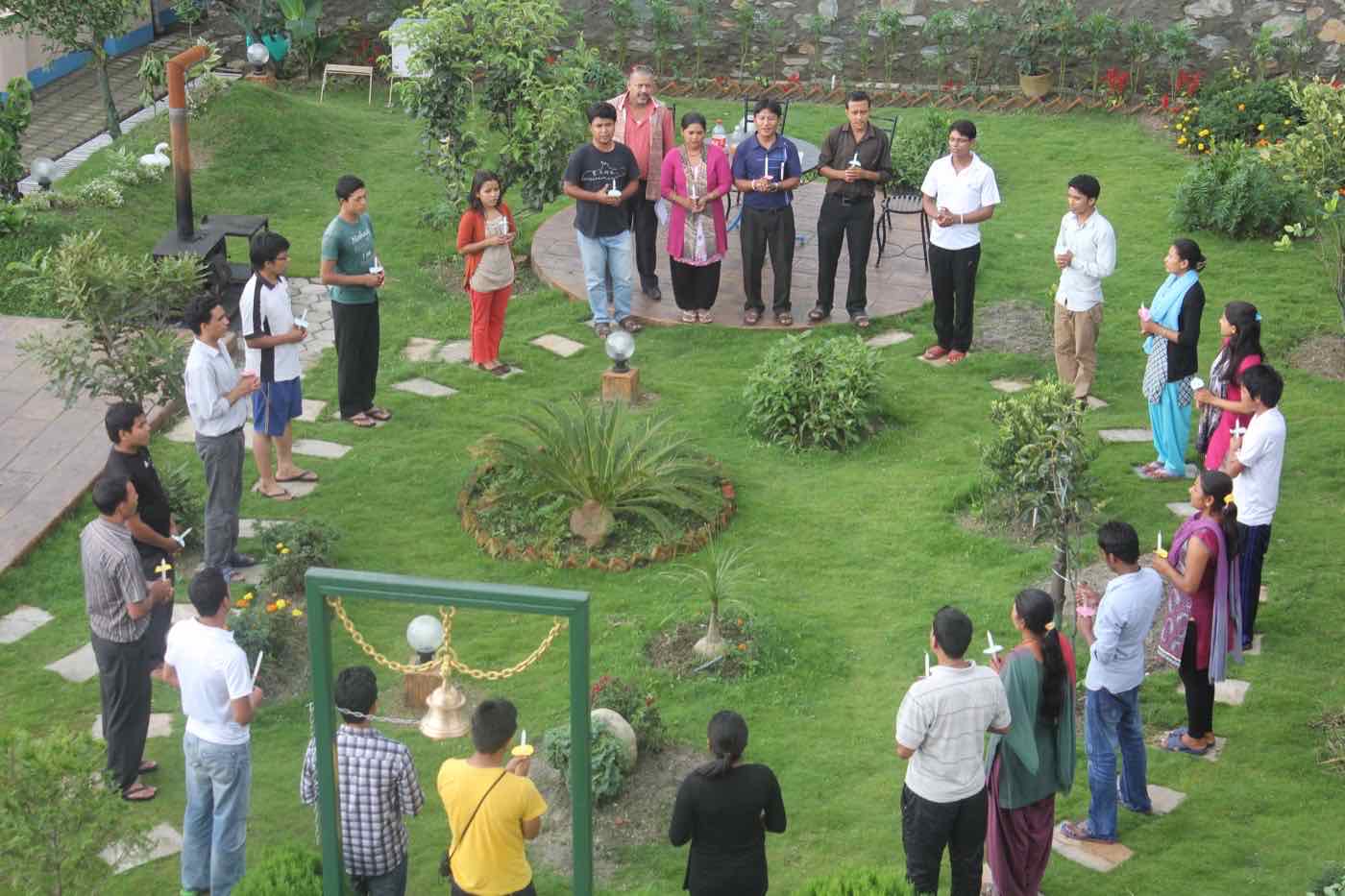 TPTC participants standing in a circle during an outdoor group activity
