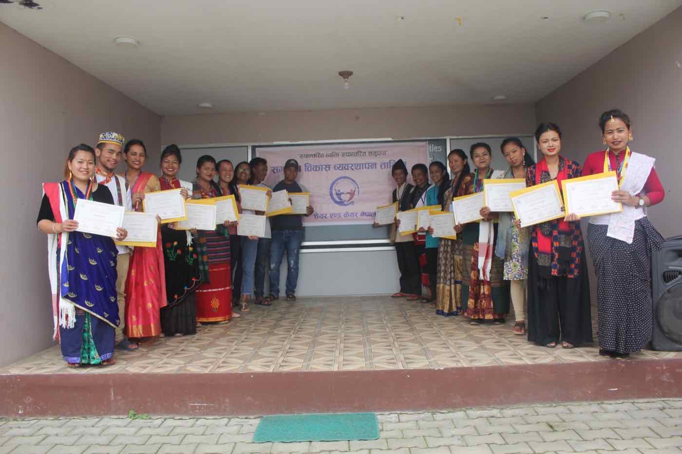 TPTC participants displaying their training certificates