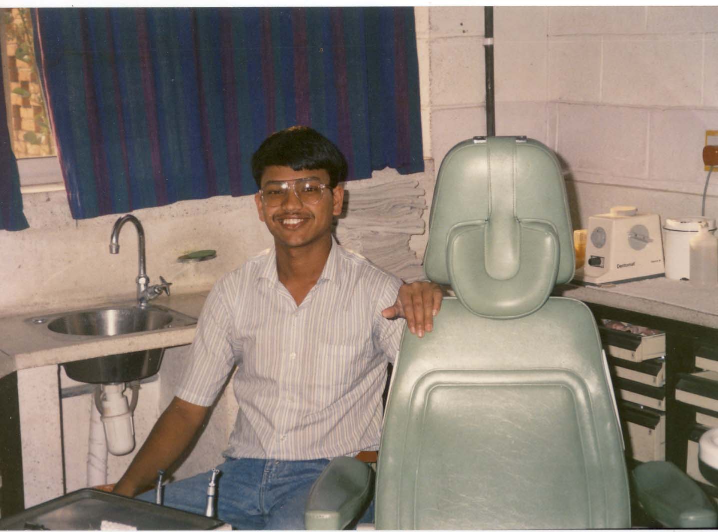 A young Ramesh Kumar Khadka beside a dental chair at Patan Hospital