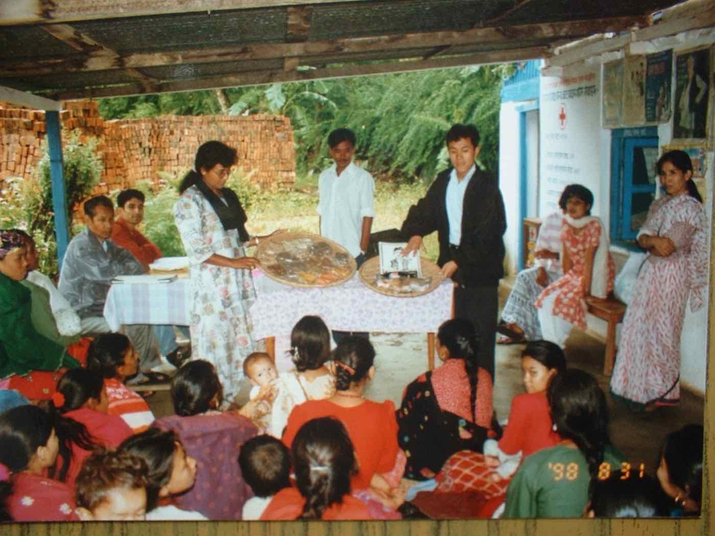 A community gathering and presentation ceremony at the CBHDP clinic
