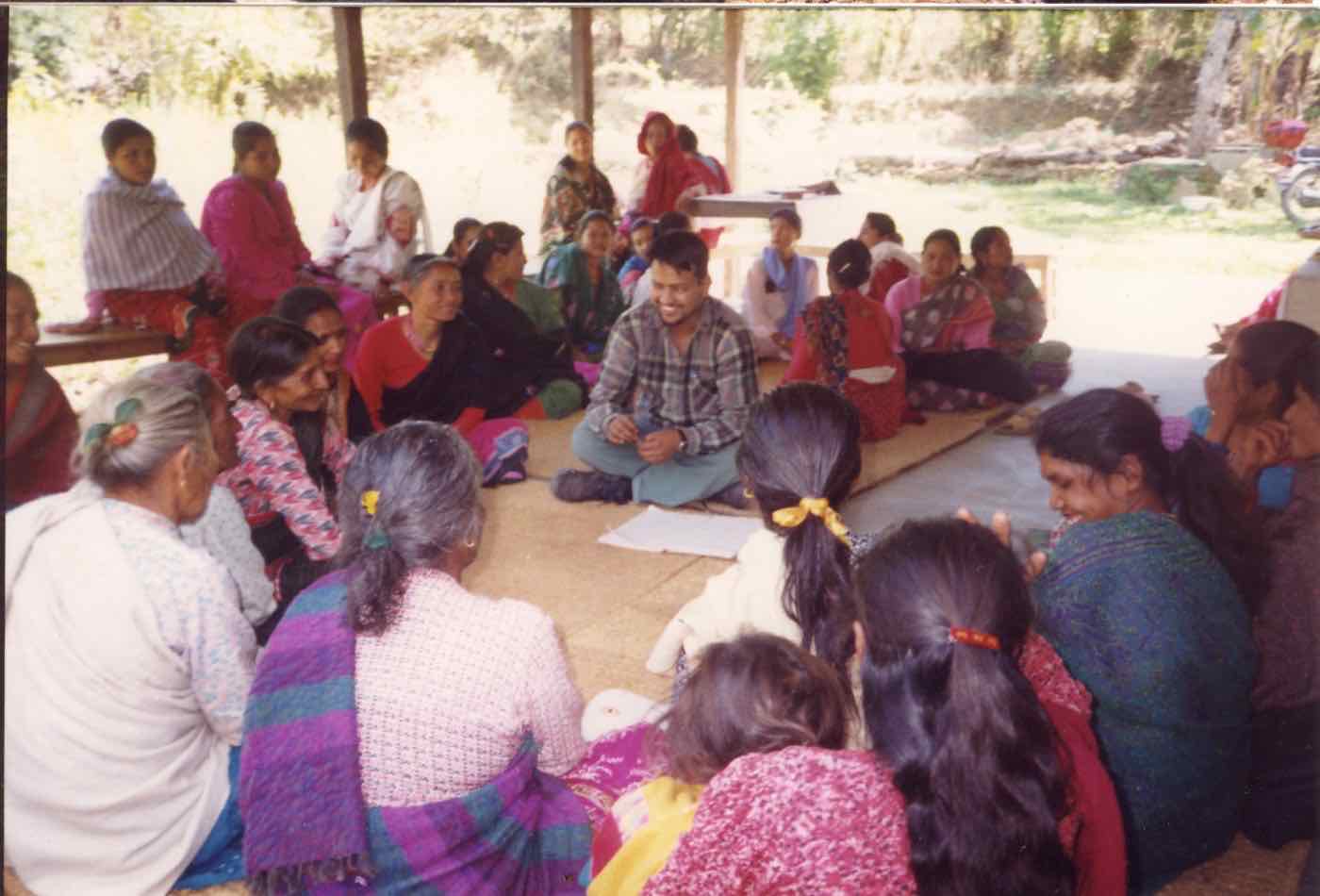 A community training session held in a circle at CBHDP